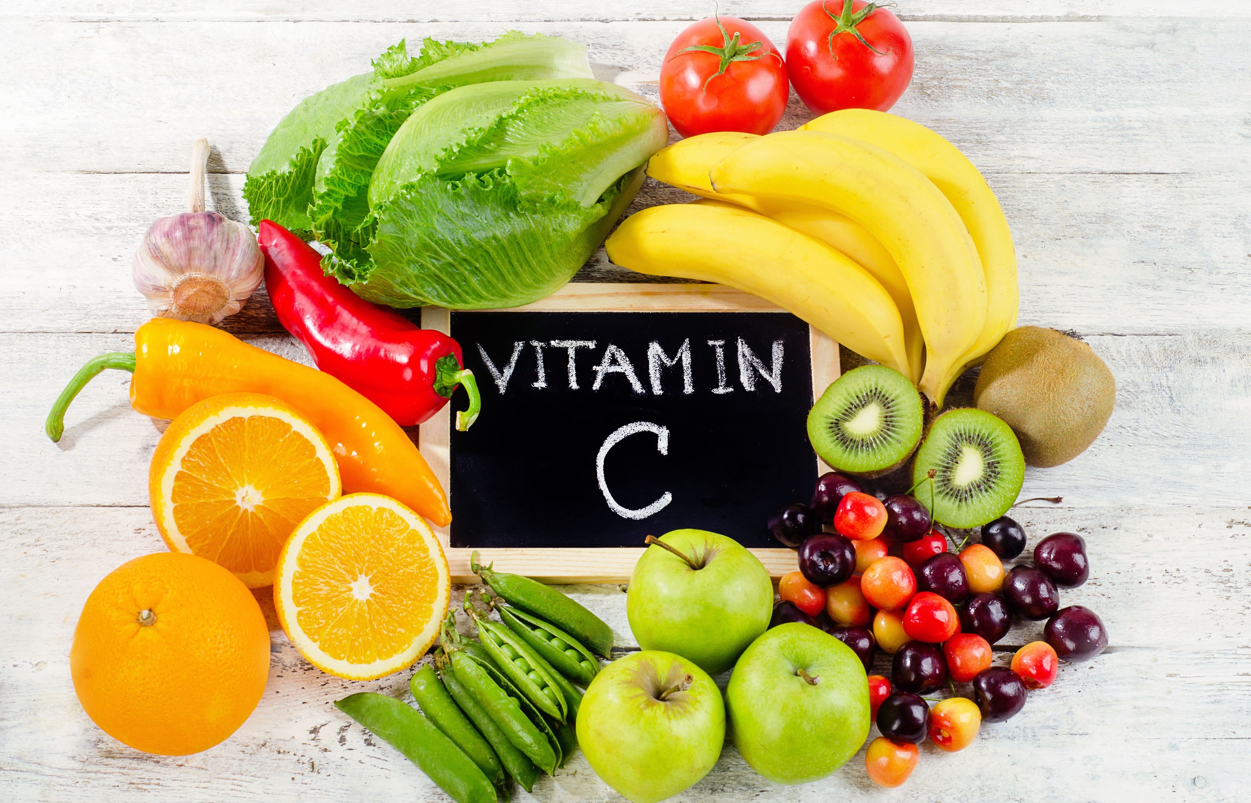 Foods High in vitamin C on a wooden board